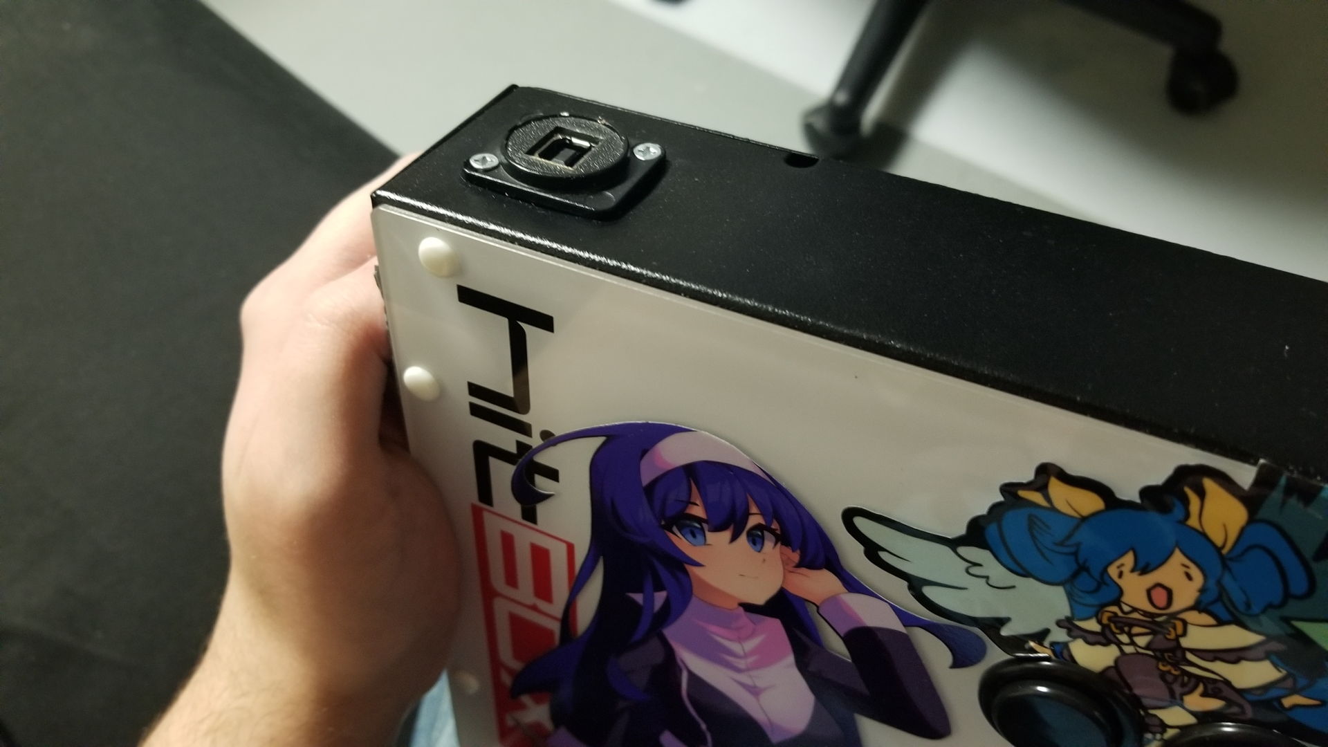 The top of my Hitbox, with a USB-B port that’s clearly aftermarket and clearly sideways